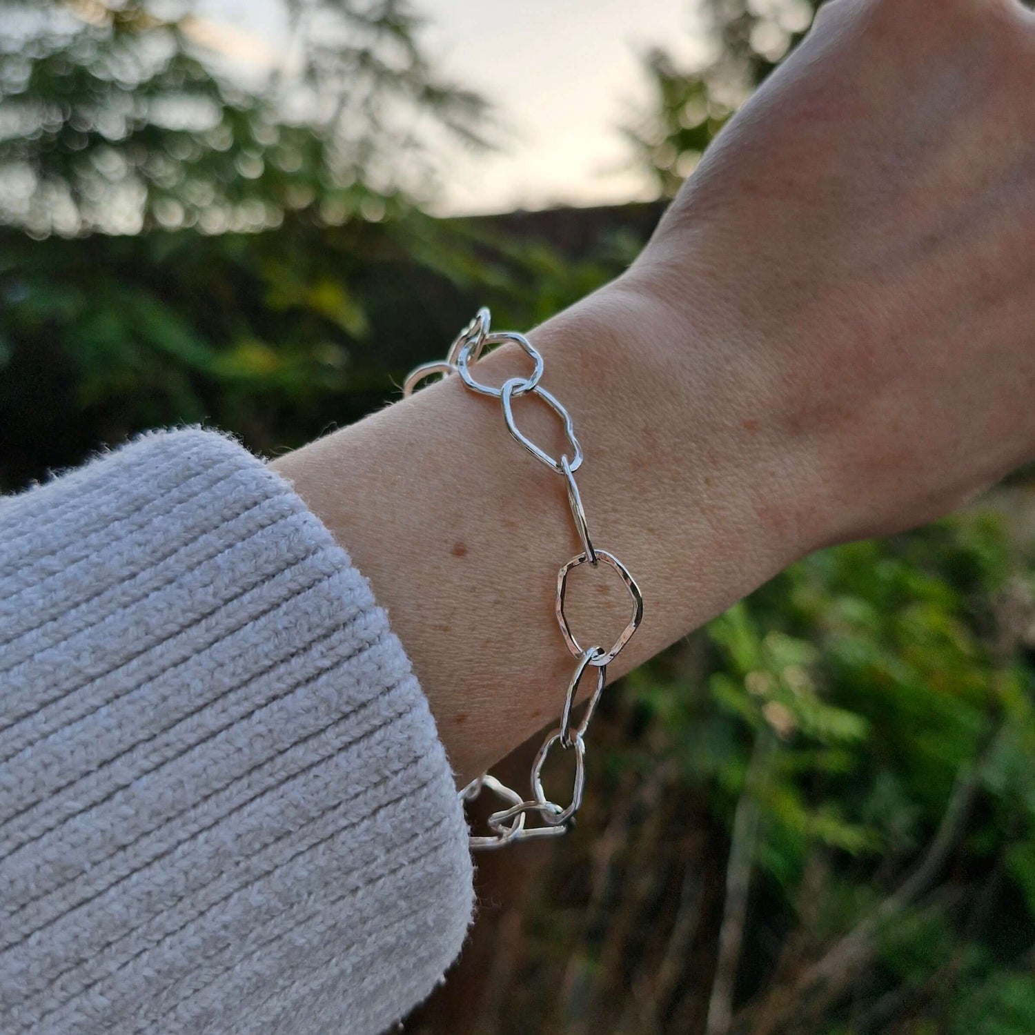 Artisanal silver bracelet collection inspired by nature's textures, handmade with diverse influences